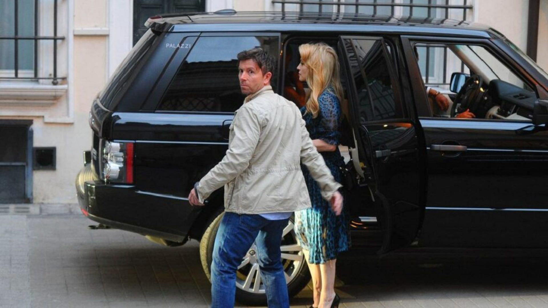 An image of Madonna getting out of a black Range Rover SV Autobiography.