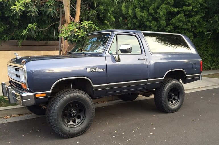 Stone Cold's blue 1988 Dodge Ramcharger parked on the side of the street