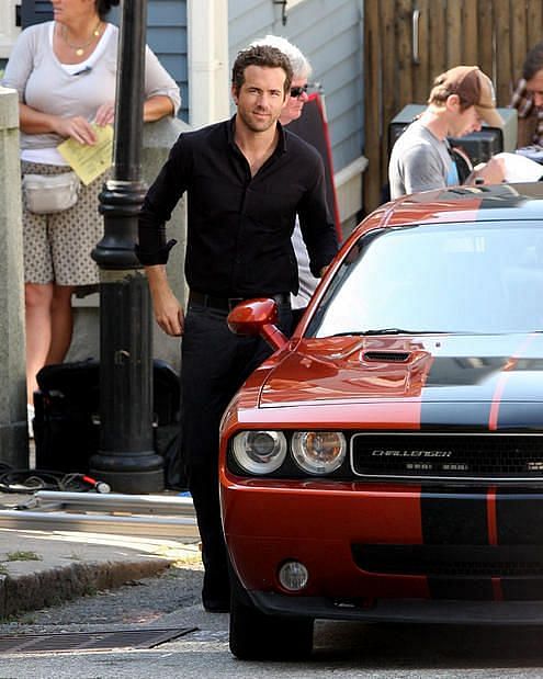 Ryan Reynolds with his dodge challenger 