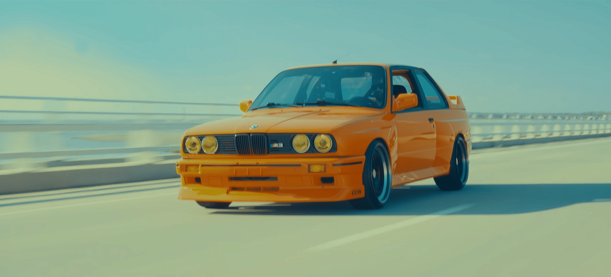 Orange 1990 BMW M3 E30