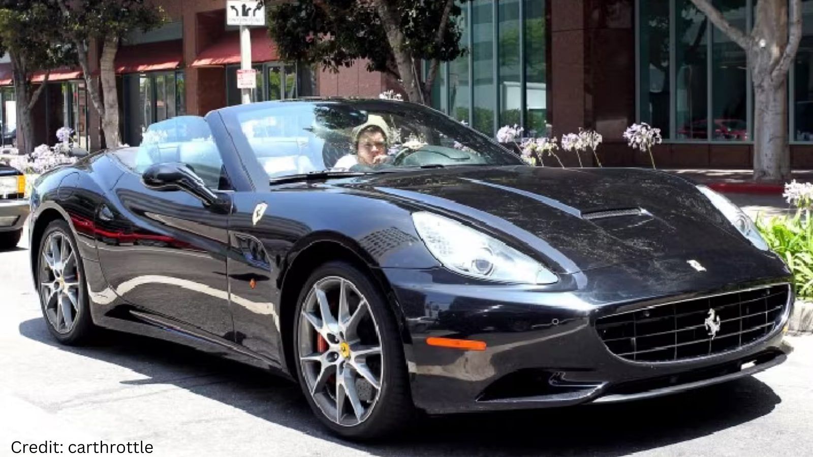 Harry Styles with a Ferrari California