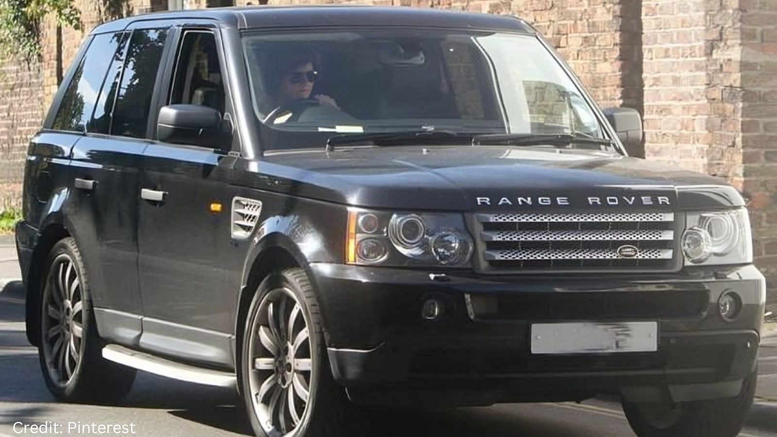 Harry Styles with a Land Rover Range Rover