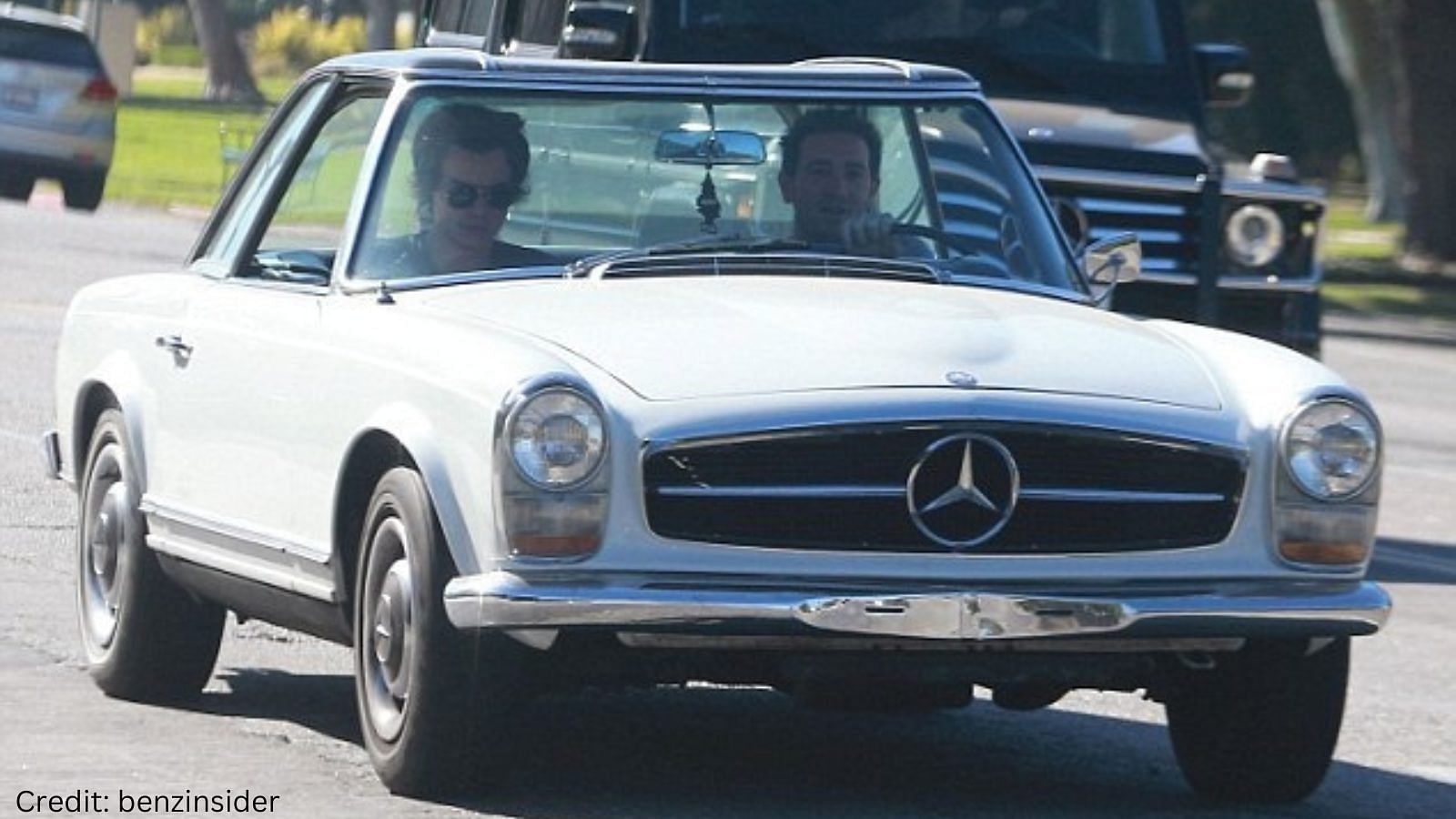 Harry Styles with a white 1966 Mercedes-Benz 230SL convertible
