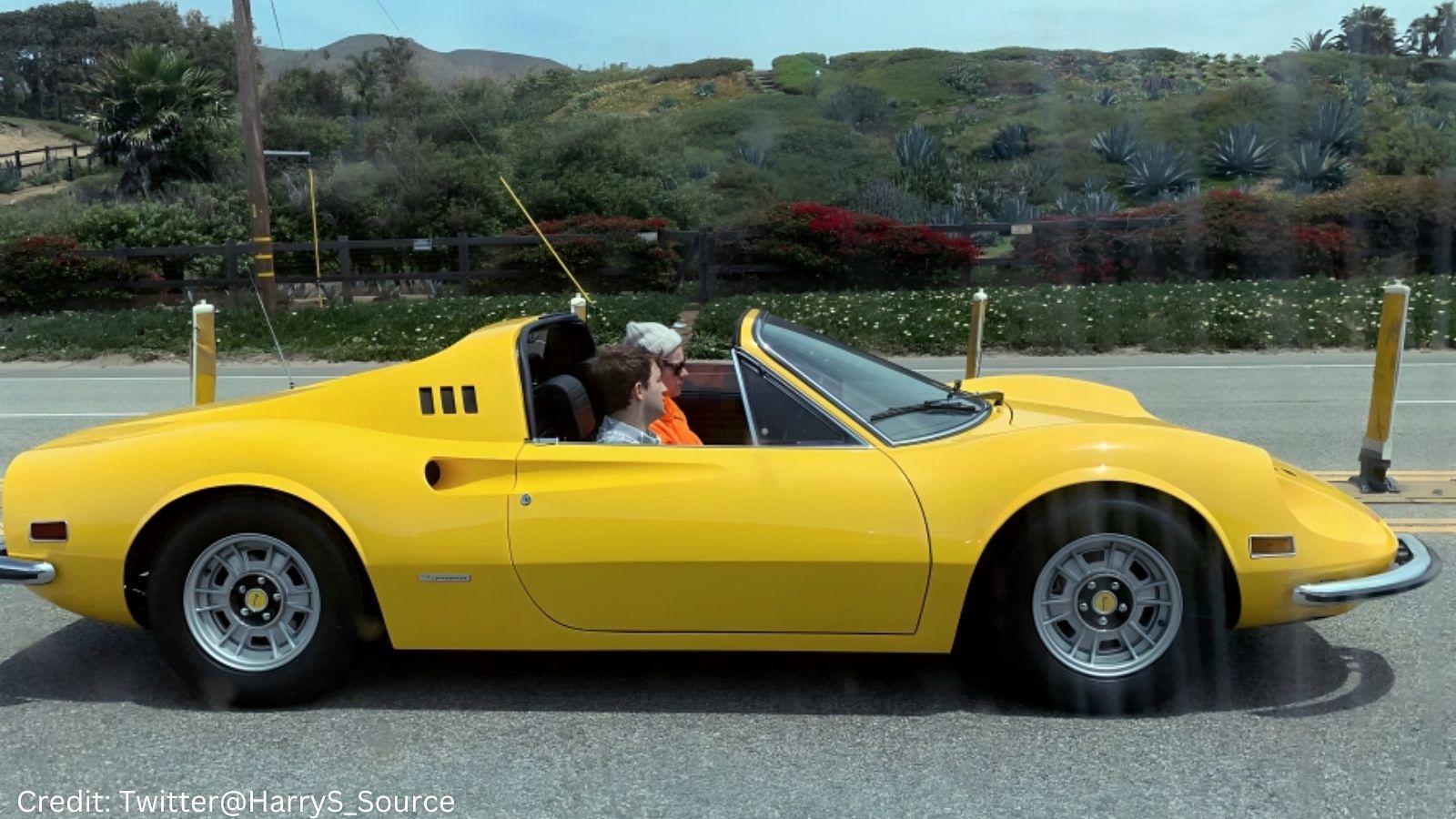 Harry Styles with a yellow 1972 Ferrari Dino 246 GT