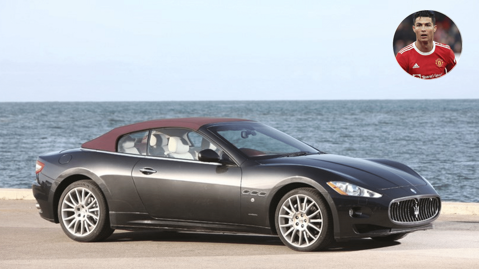 Black 2011 Maserati GranCabrio in front of the sea