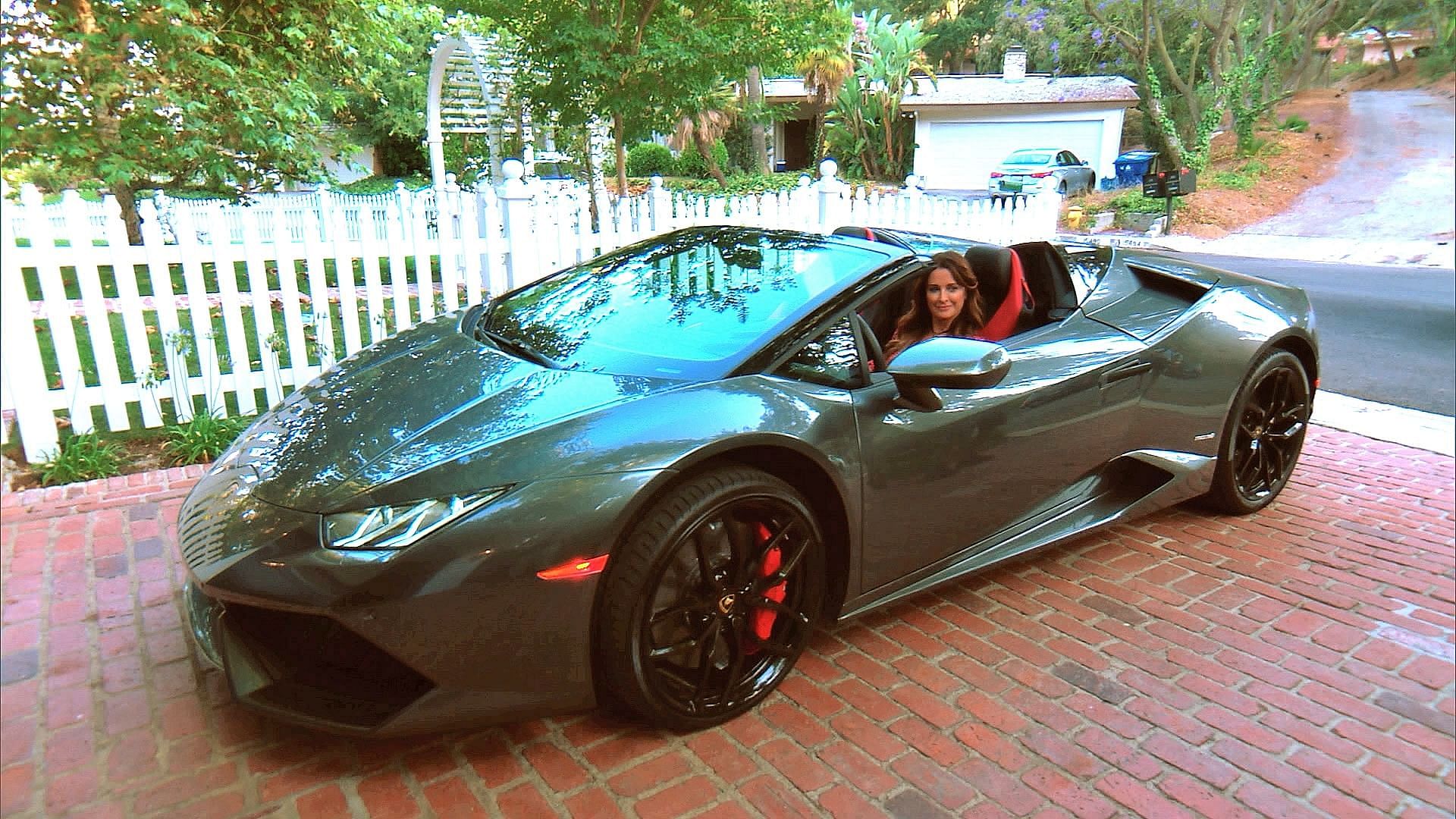 Kyle Richards being seated inside her 2016 Lamborghini Huracan RWD spyder