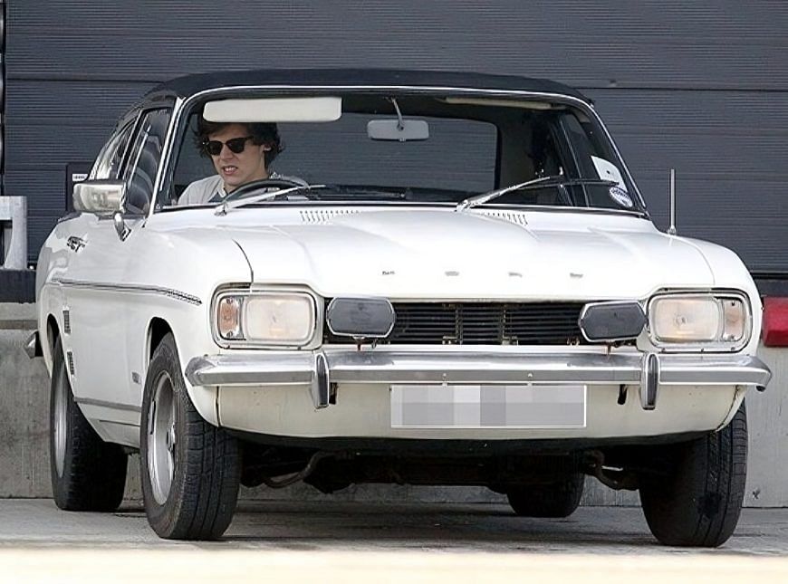 Harry Styles with his Ford Capri