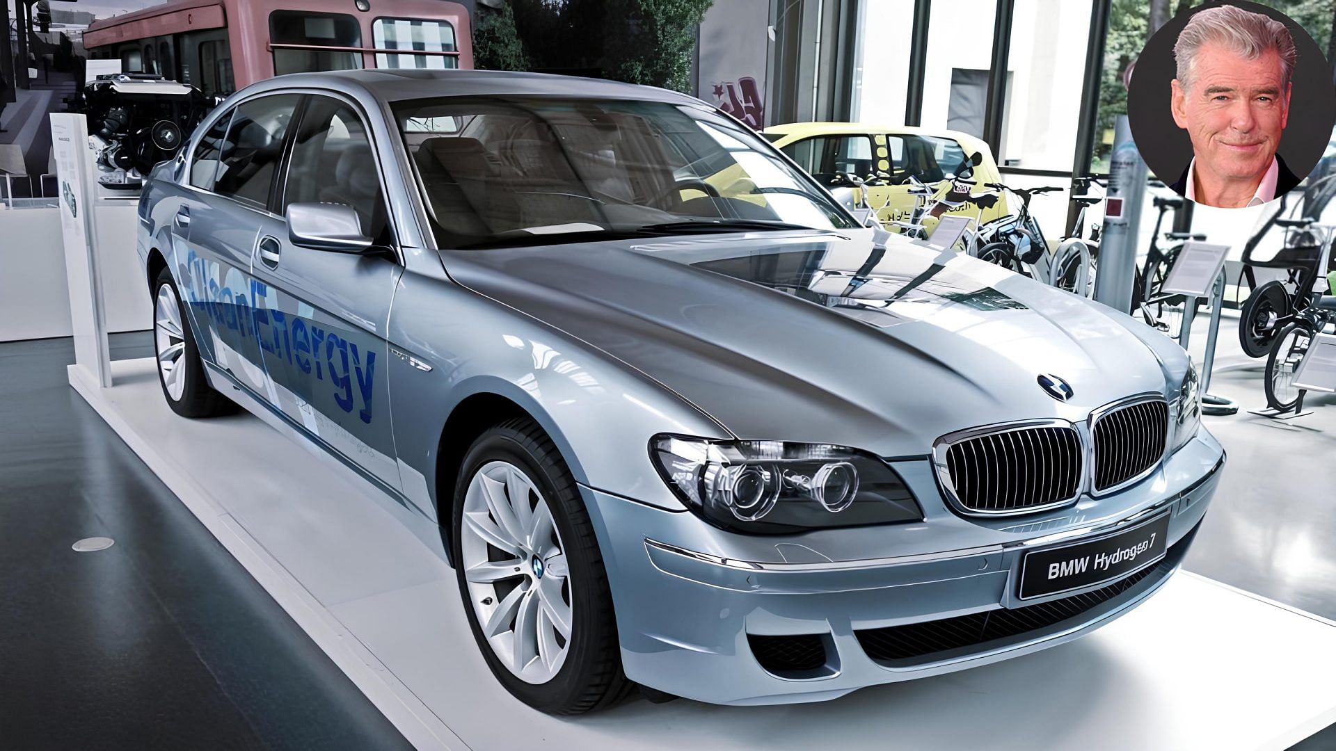 Silver 2007 BMW Hydrogen 7 with a cutout of Pierce Brosnan