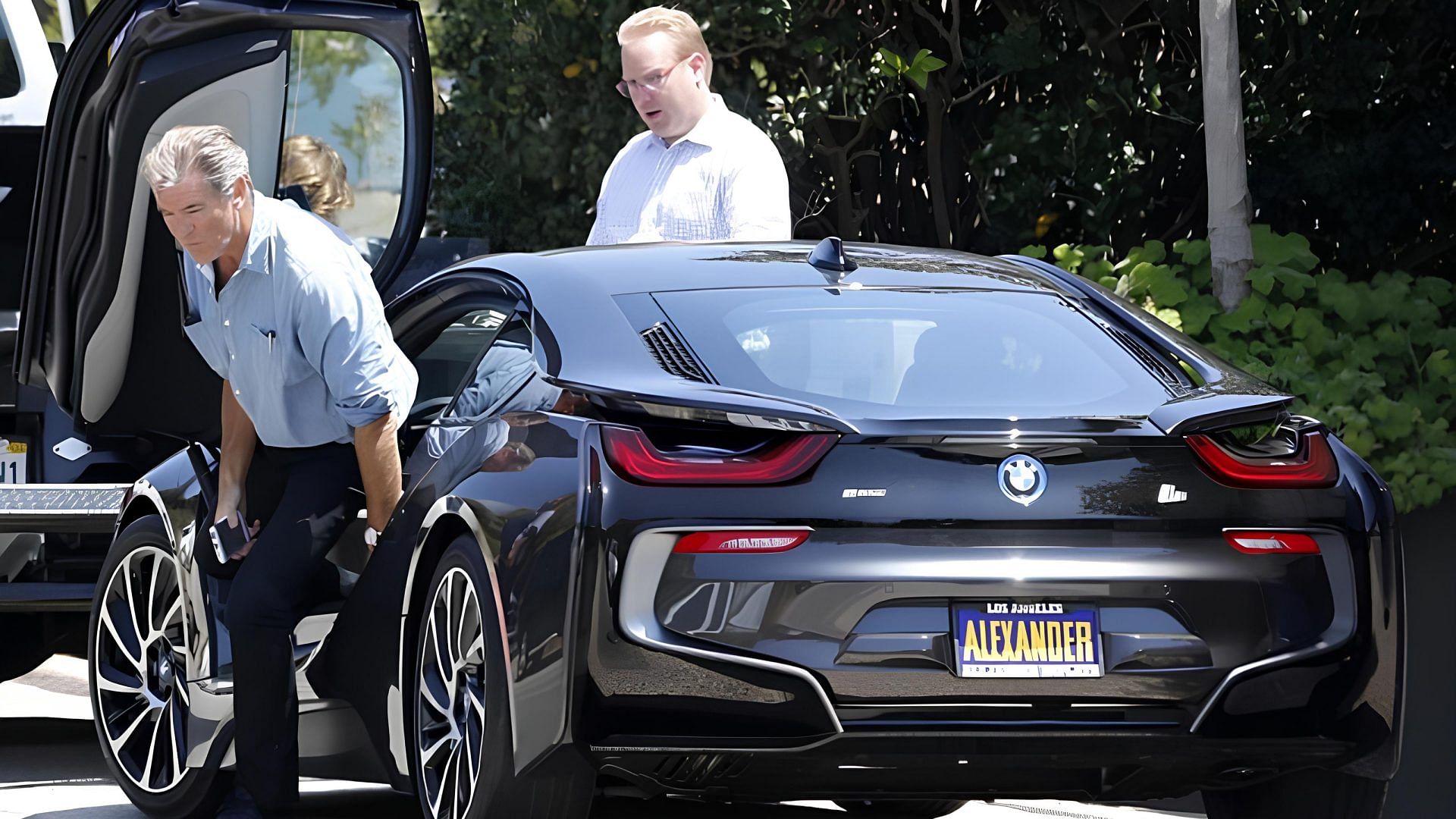 Pierce Brosnan coming out of his 2014 BMW i8 plug-in-hybrid